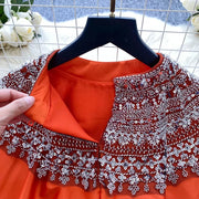 Loose satin blouse with long sleeves and batwing neck, with embroidered beads and high-quality sequins