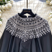 Loose satin blouse with long sleeves and batwing neck, with embroidered beads and high-quality sequins