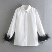 Elegant white long sleeve blouses with feathers on the cuffs
