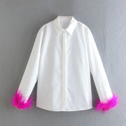 Elegant white long sleeve blouses with feathers on the cuffs
